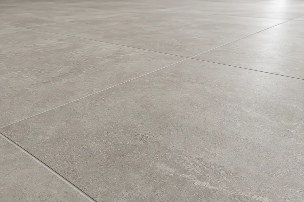 Close-up of large-format light grey porcelain tiles with thin grout lines